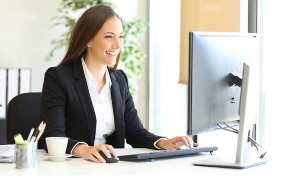 insurance or real estate agent on computer quickly enrolling in Tend with one price coverage